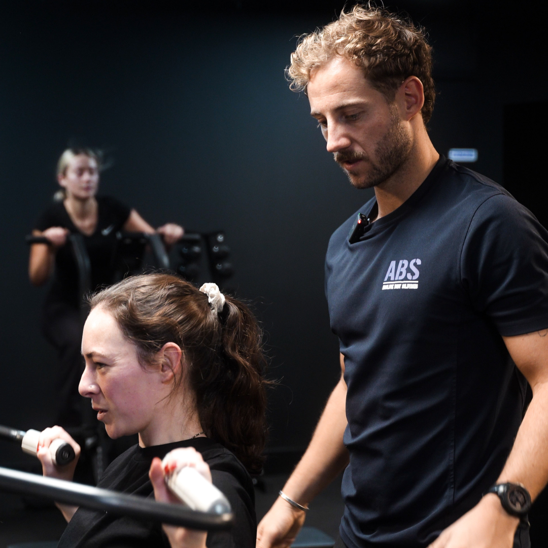 client performing an exercise during a personal training session at ABS gym in the city of london